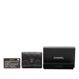 Chanel
CC Quilted Caviar Flap Trifold Wallet